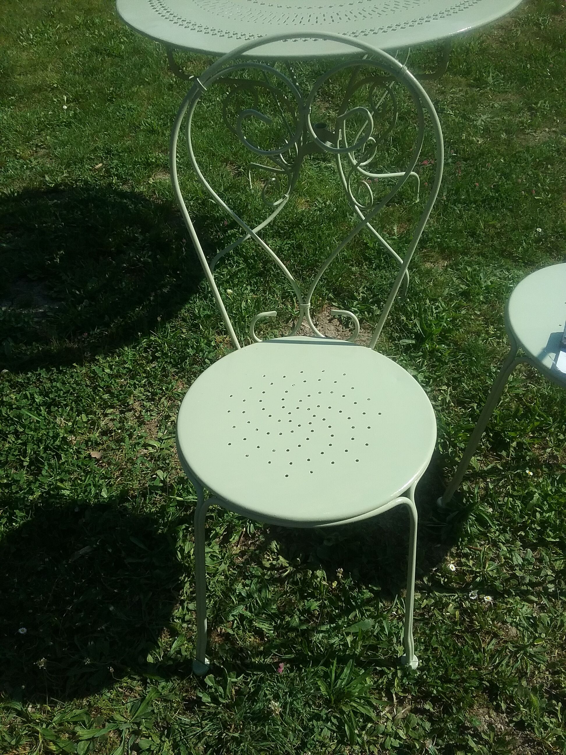 Green wrought iron garden furniture