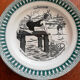 Old vintage dessert plate with drawing and phrase "swimming"