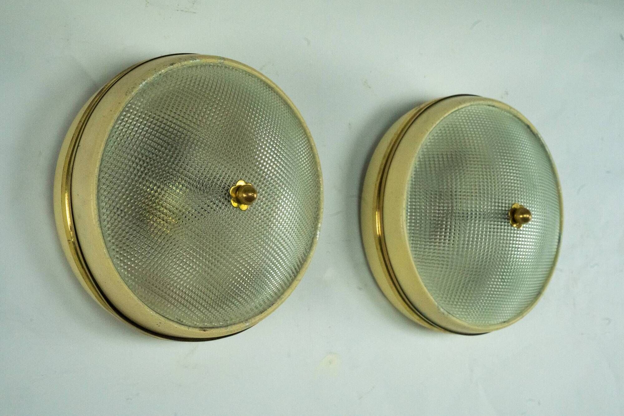 Lumi Milano, pair of wall or ceiling lamps in glass, brass and lacquer, 50s