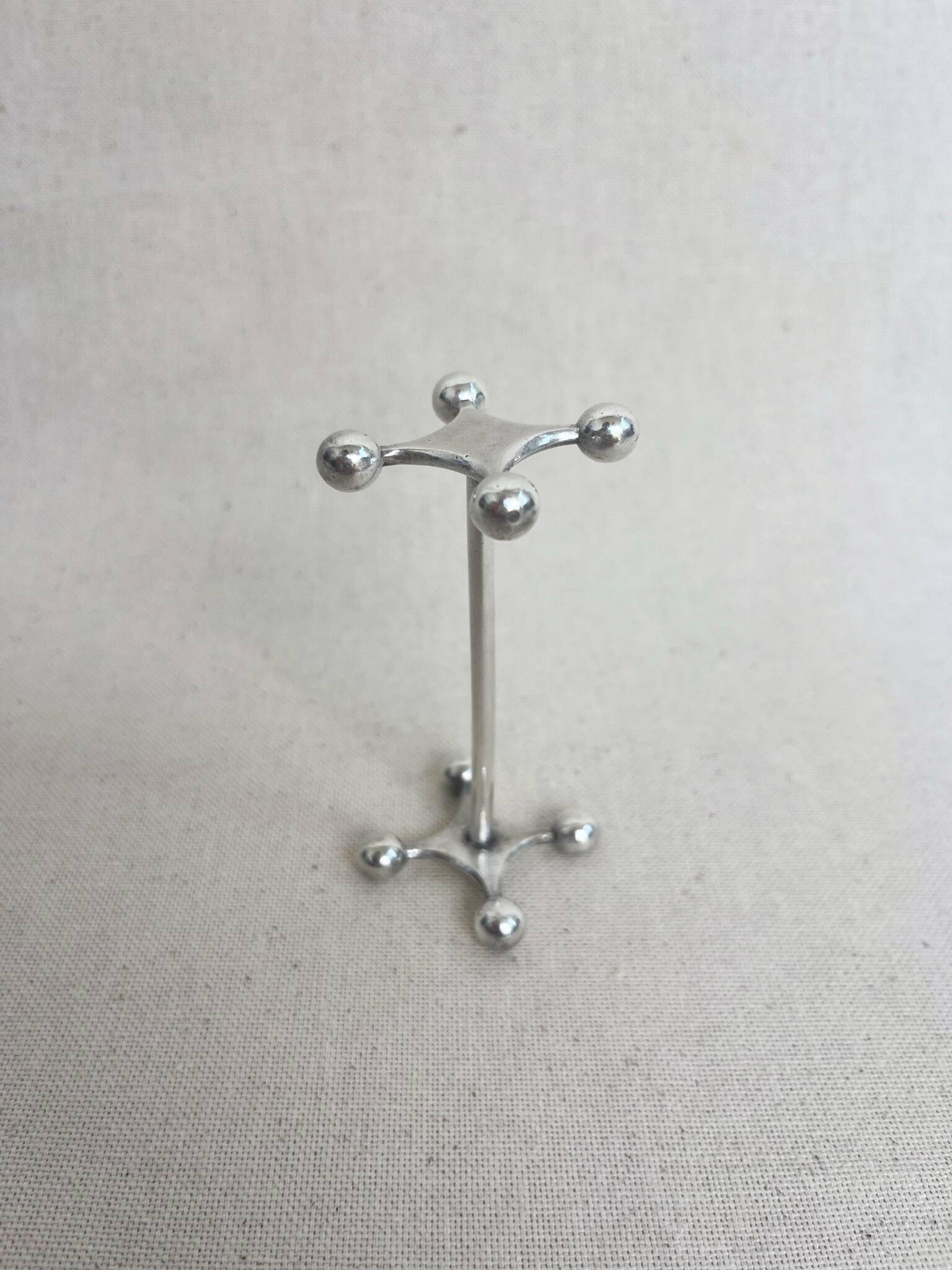 series of brutalist and sculptural silver-plated knife rests
