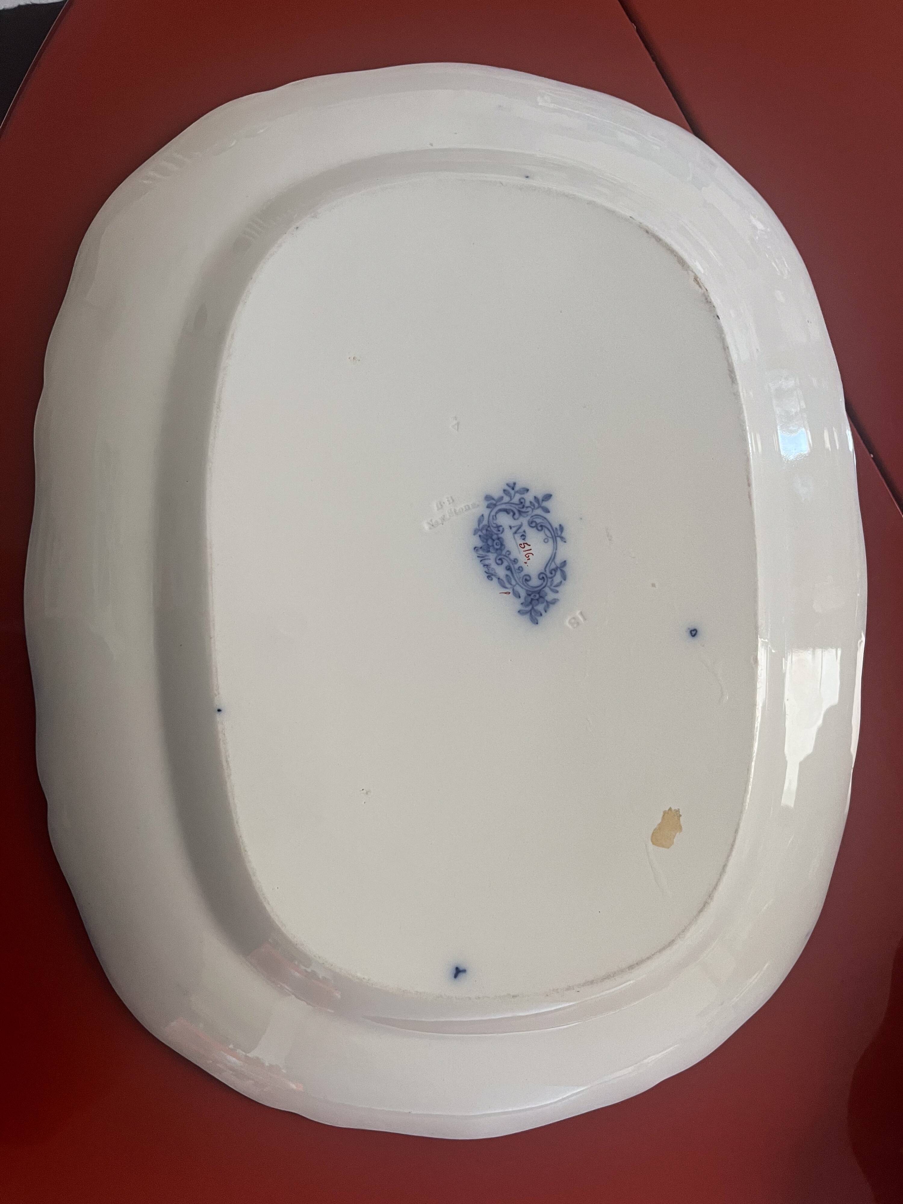 Large hollow dish in fine earthenware with Japanese decoration.