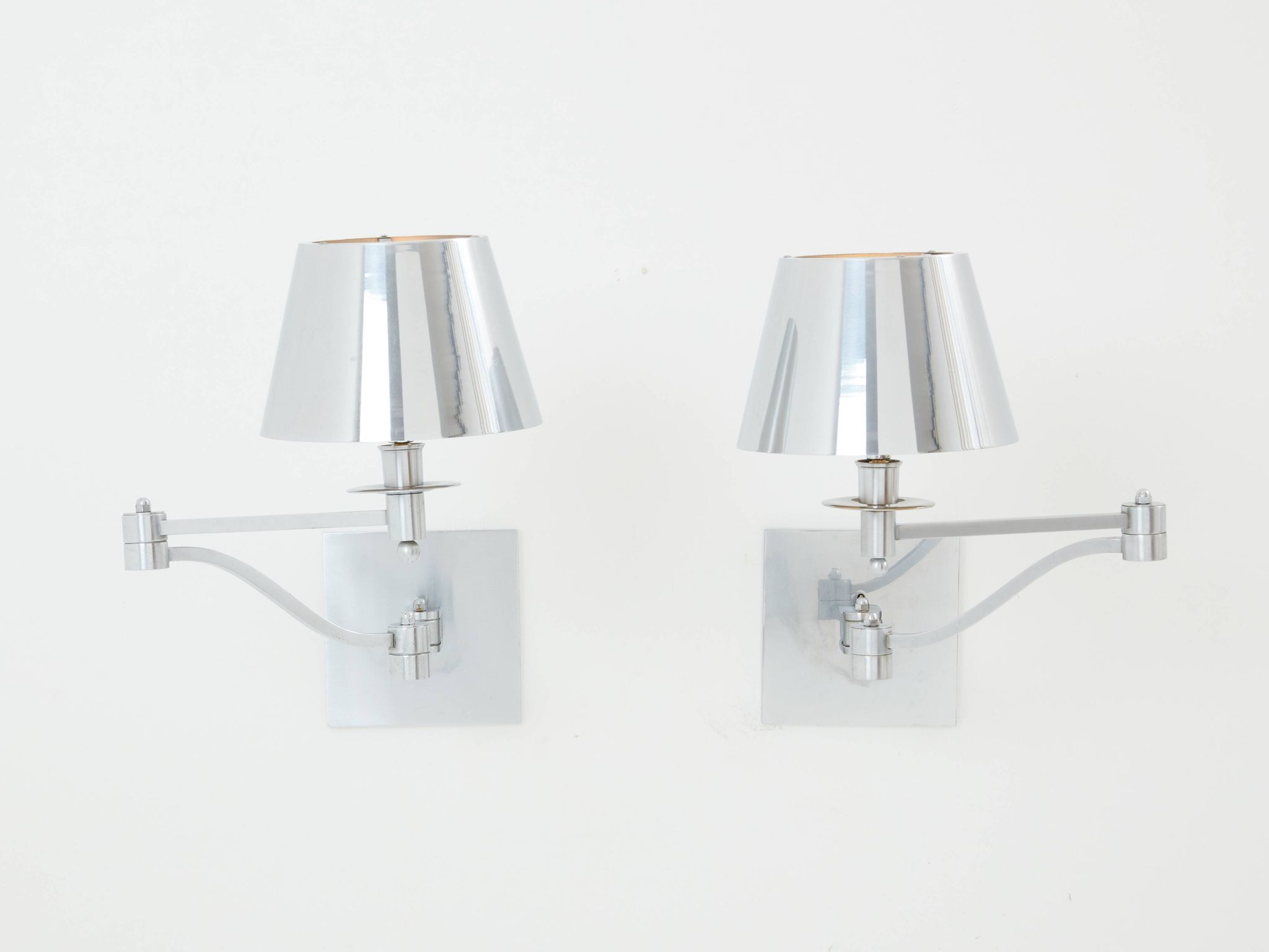 Pair of Maison Charles adjustable brushed steel wall lights circa 1960