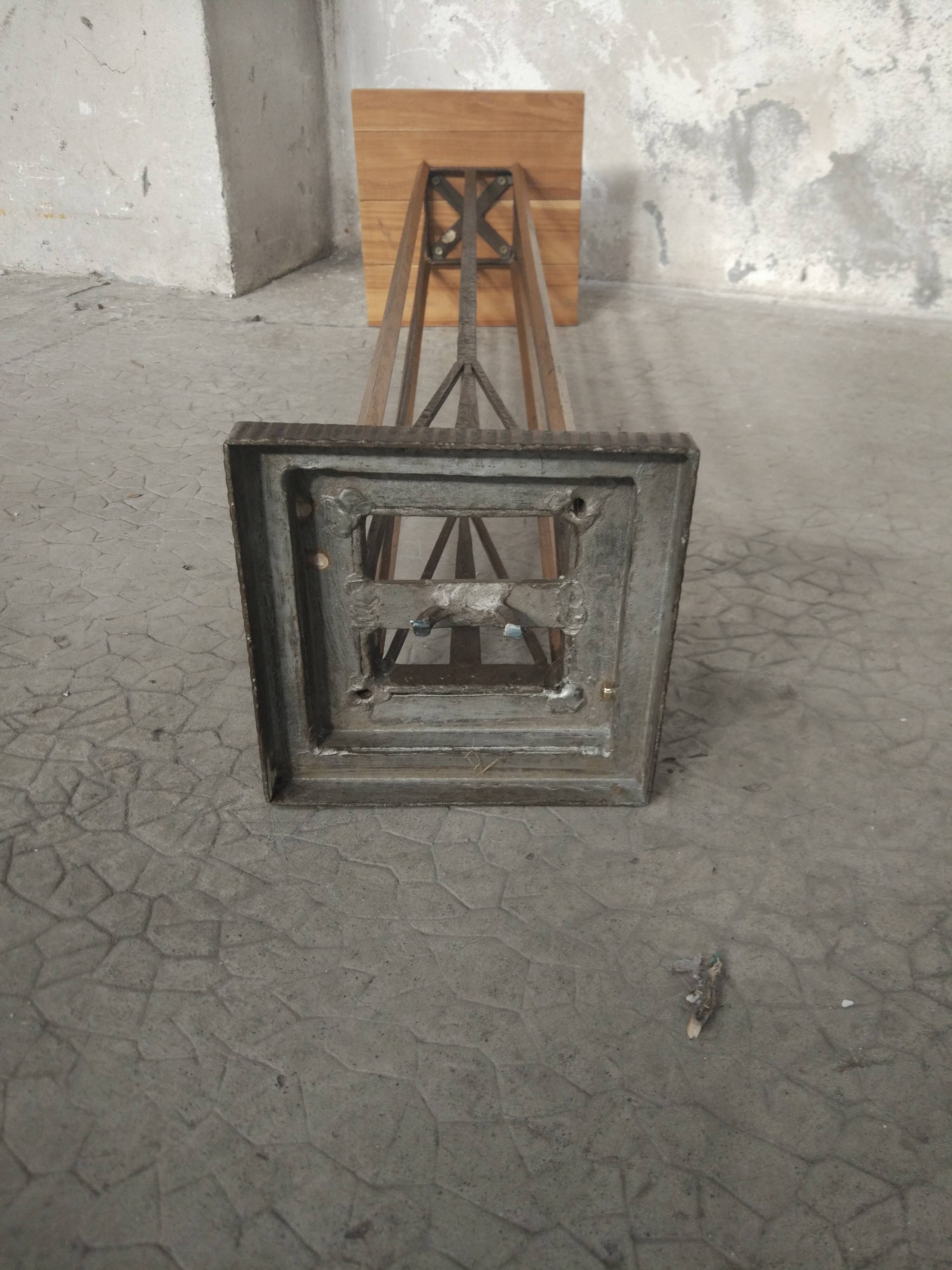 Column 1930 with one foot in wrought iron