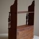 Primitive wall shelf in pine, by a Swedish upholsterer, late 19th century.