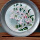 Duo of sub bouteilles or metal and ceramic coasters