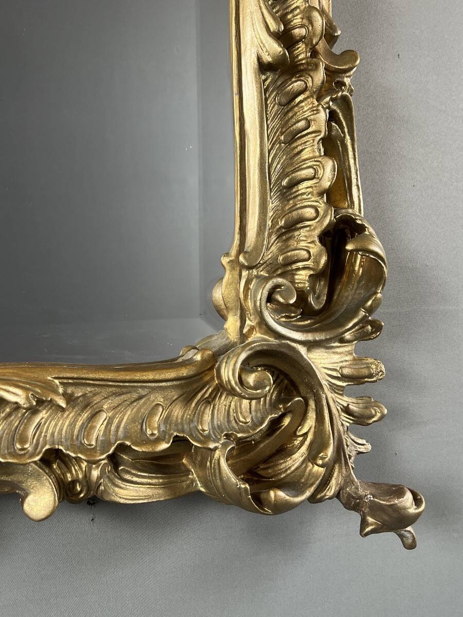 Large gilded wooden mirror in Louis XV style, 19th century.