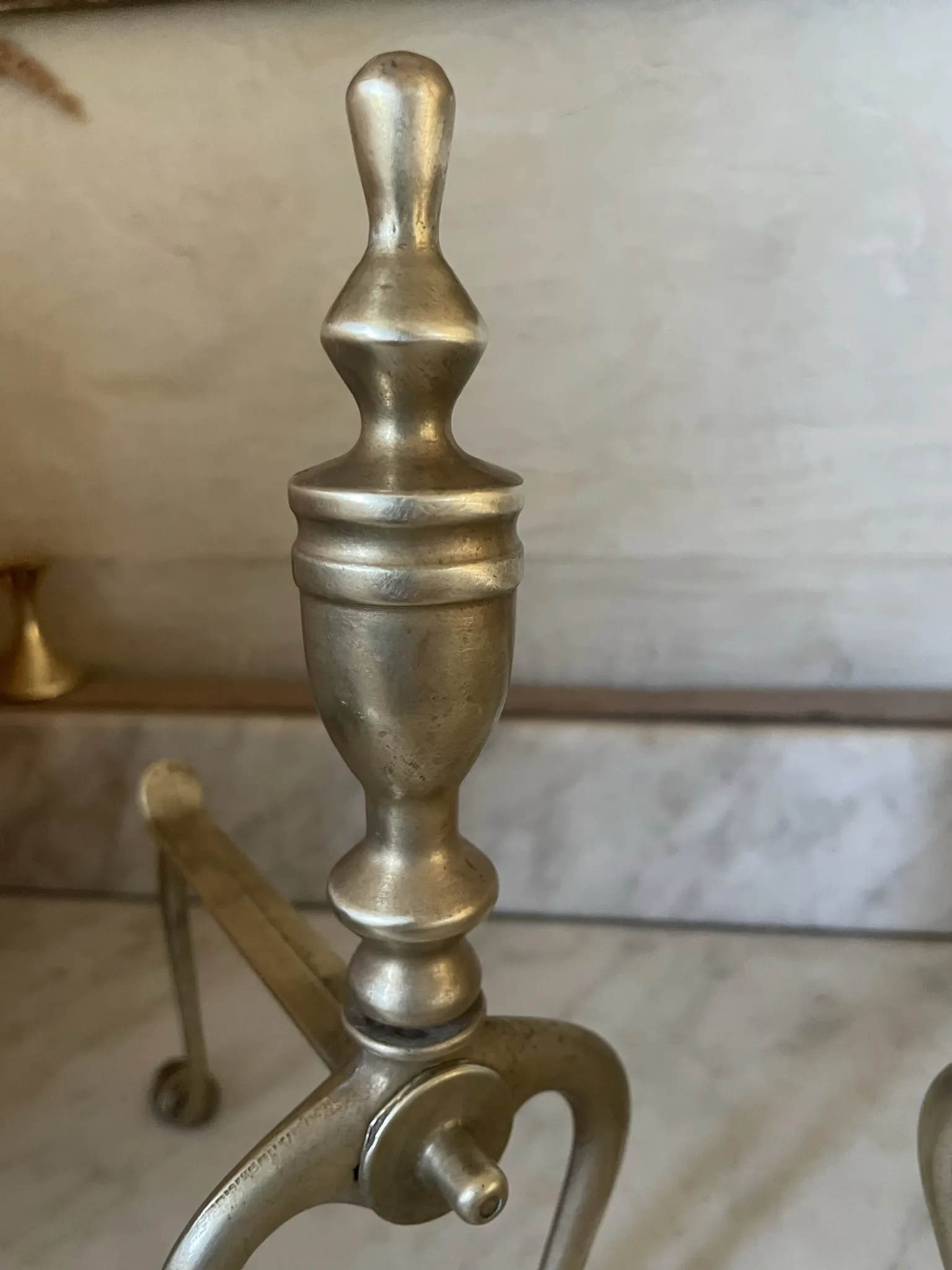 Pair of Victorian brass fire dogs from the late 19th century.