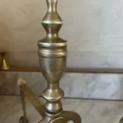 Pair of Victorian brass fire dogs from the late 19th century.