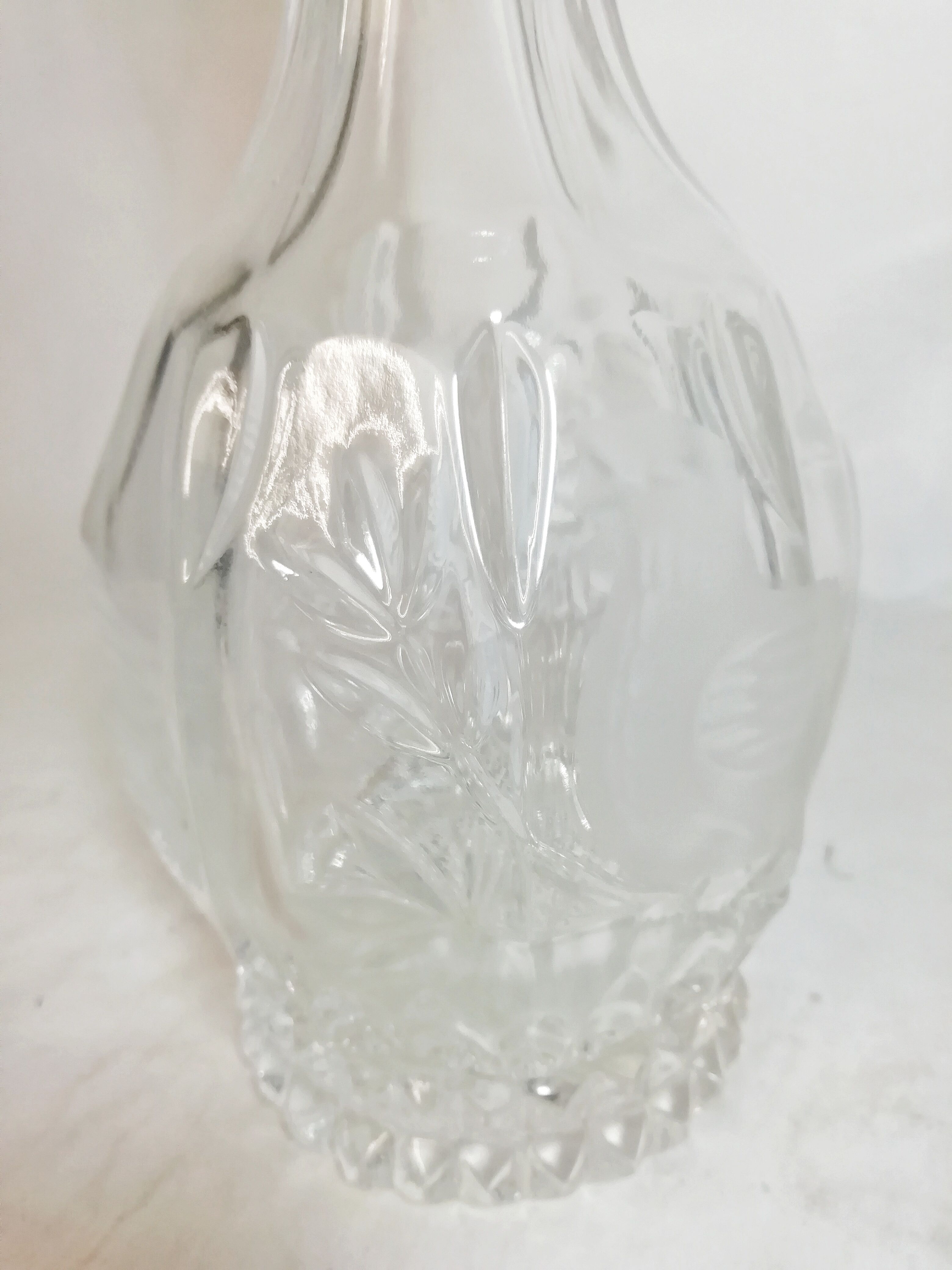 Carved glass bottle