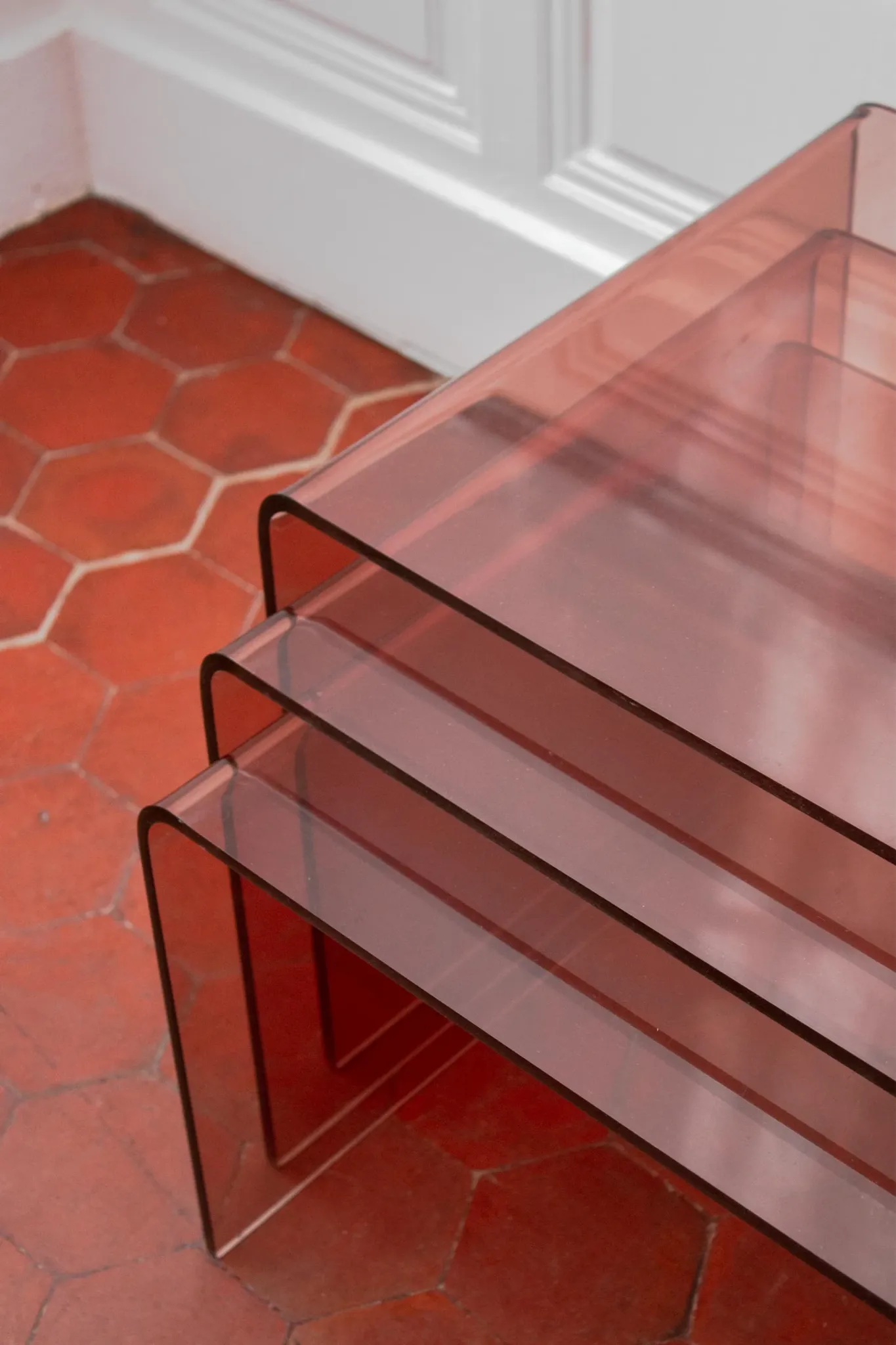 Vintage trio of nesting tables in smoked plexiglass by Michel Dumas, year