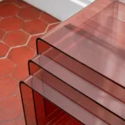 Vintage trio of nesting tables in smoked plexiglass by Michel Dumas, year