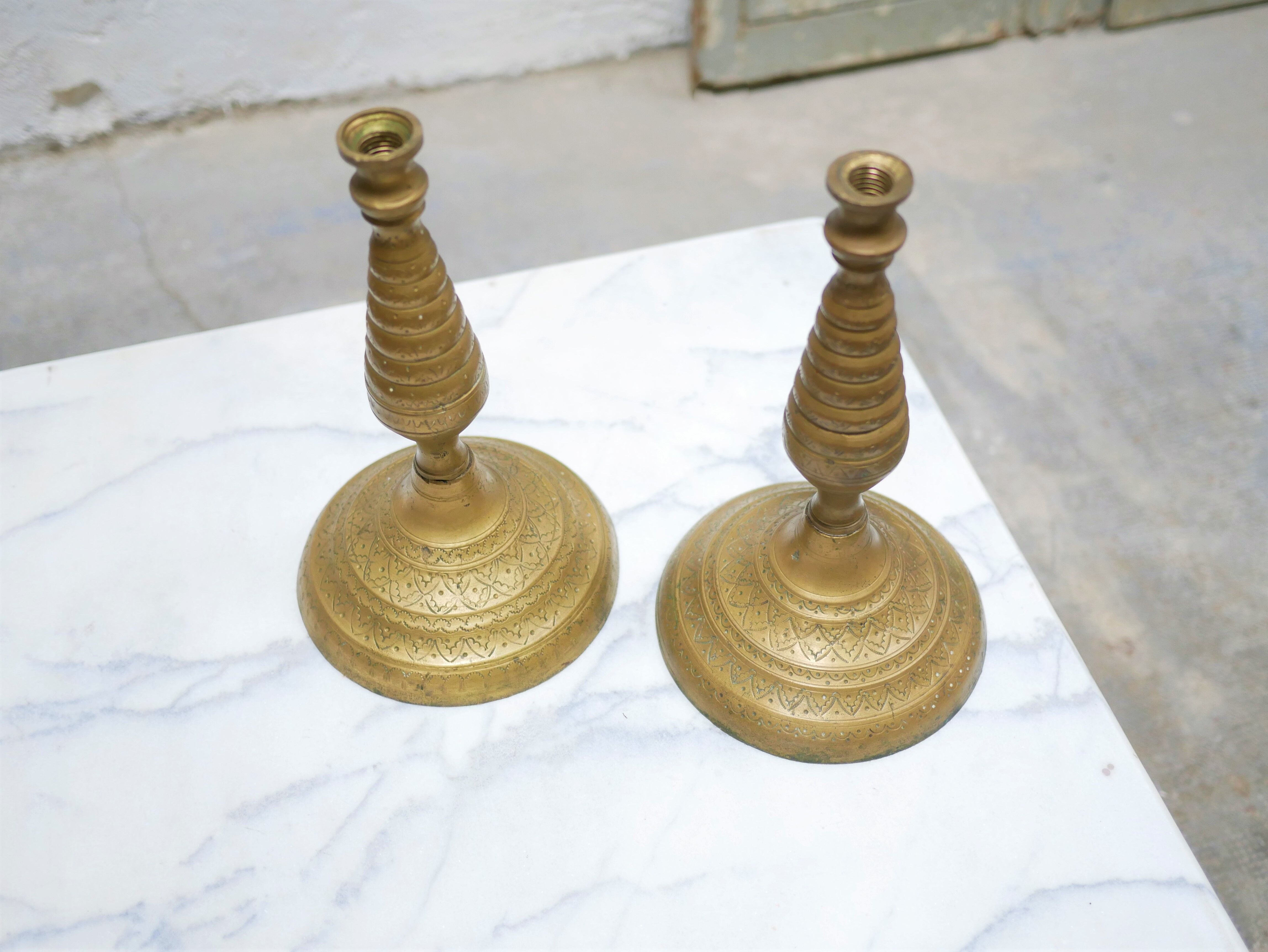 Pair of vintage candle holders in golden brass