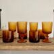 8 mismatched vintage amber glasses