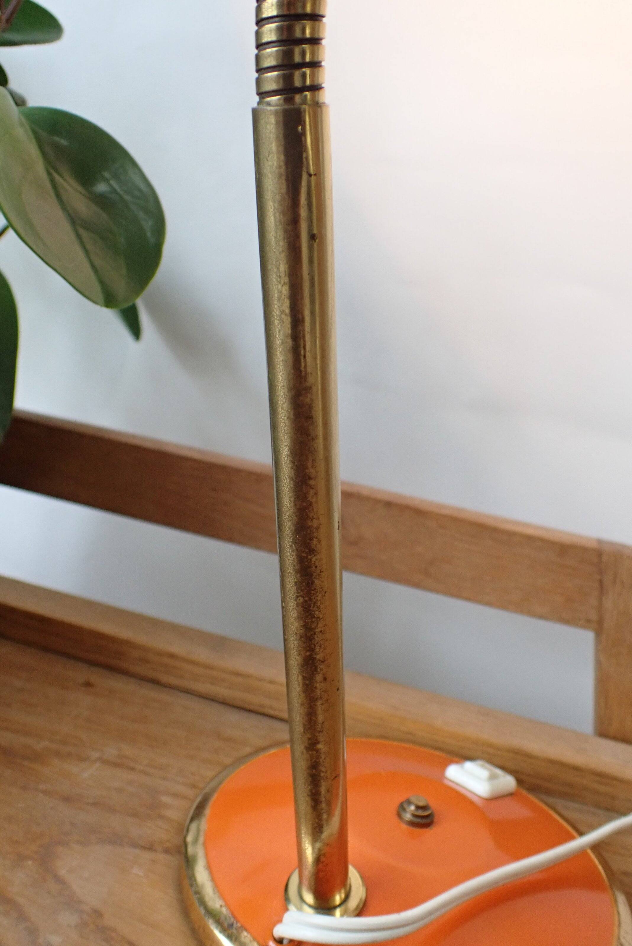 Vintage adjustable lamp, orange, made of metal.