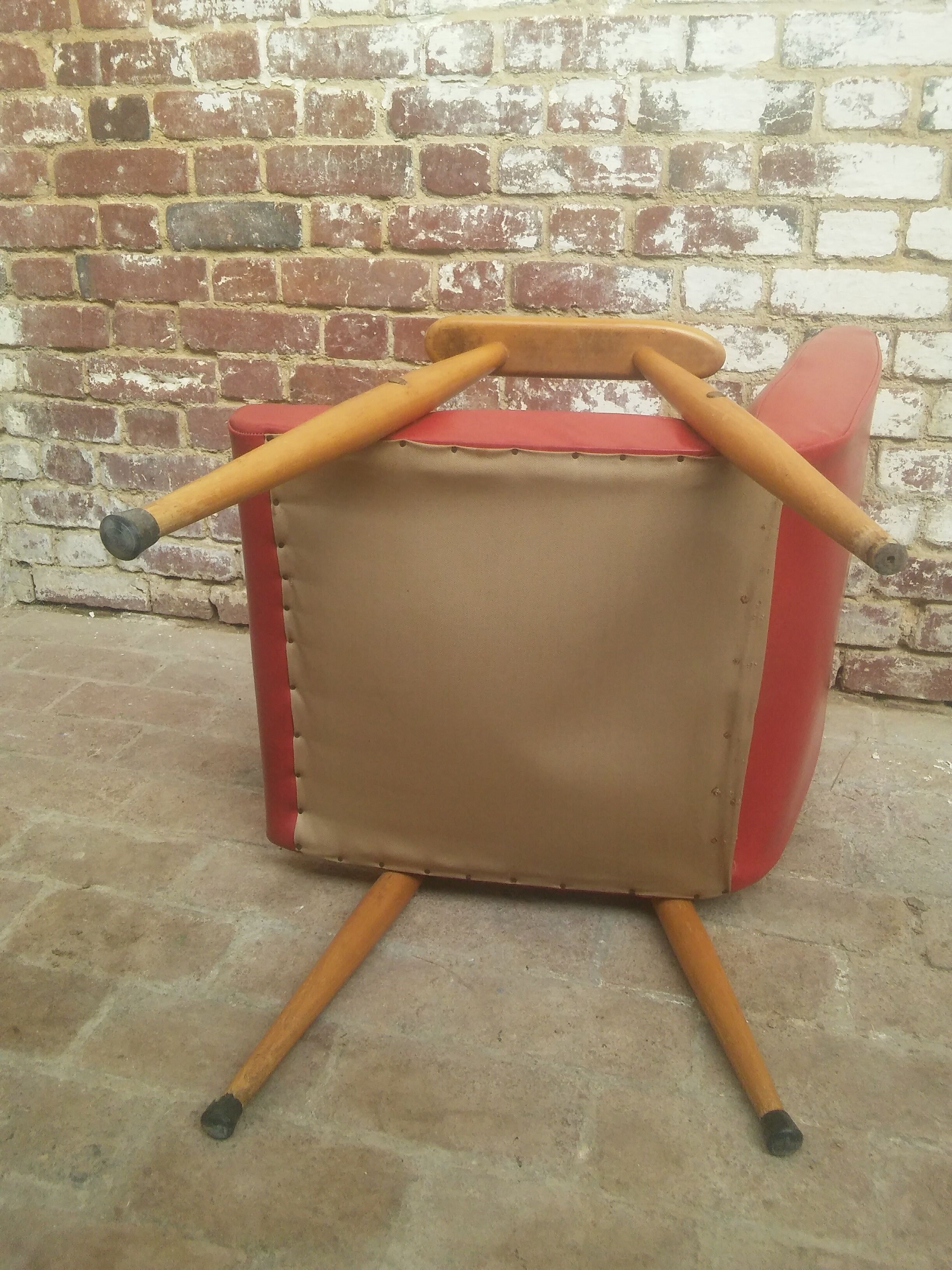 Red armchair with compass feet 50s