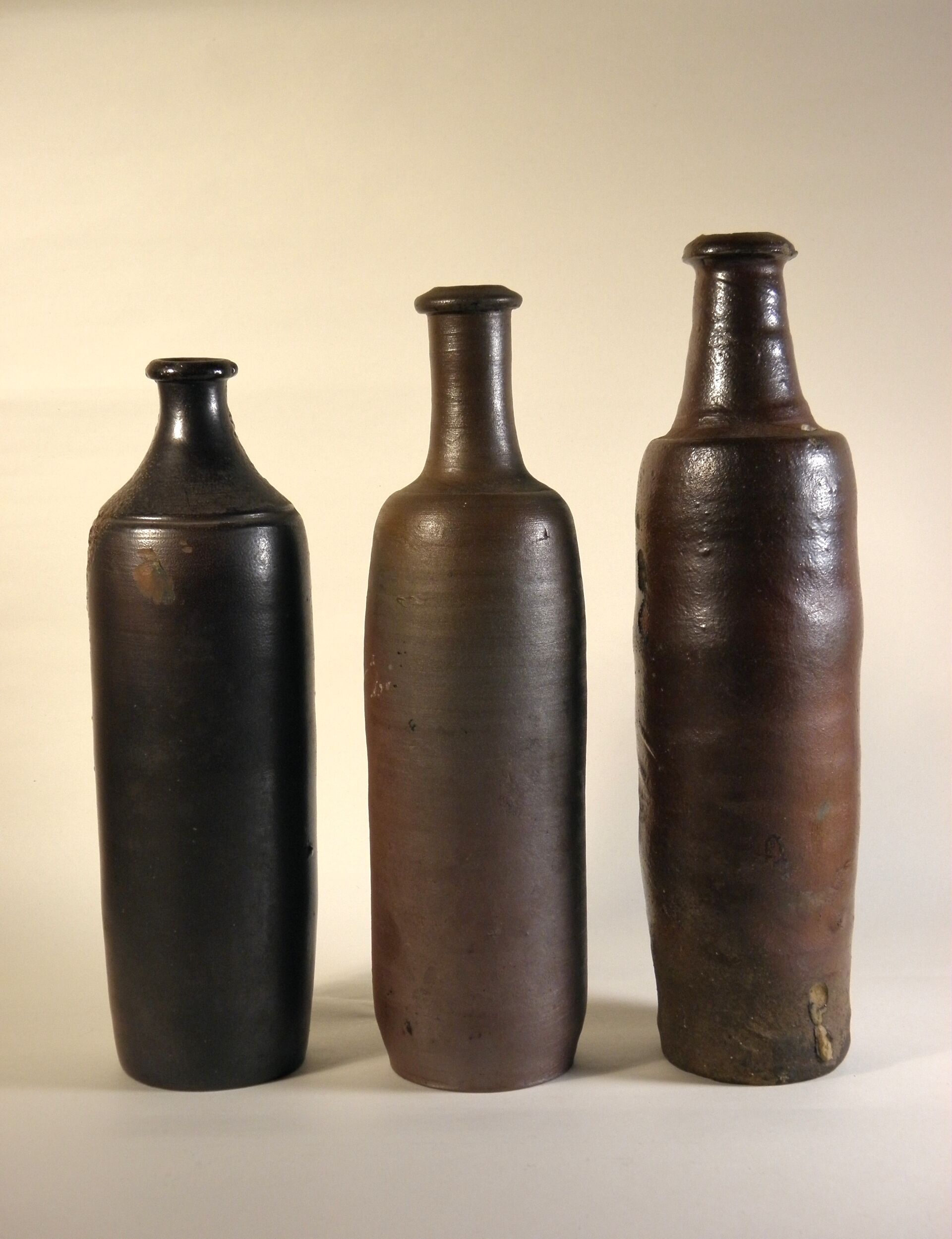 Lot of three old sandstone bottles