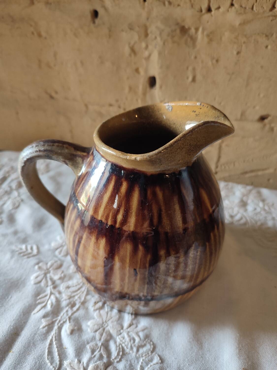 Old sandstone pitcher vase