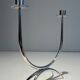 Silver-plated metal and plexiglass design candlestick.