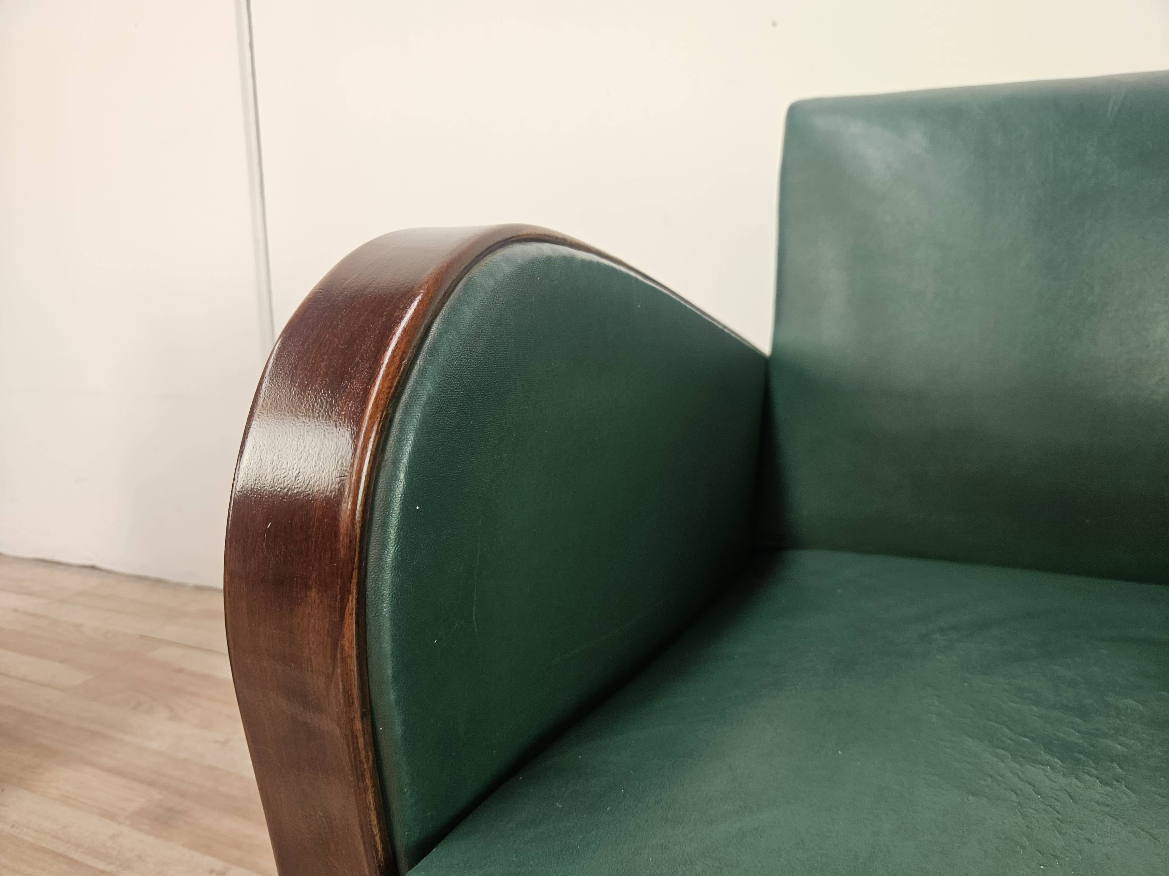 Pair of Art Decò armchairs in walnut and green leather, 1940
