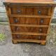 Small English chest of drawers with a folding top.