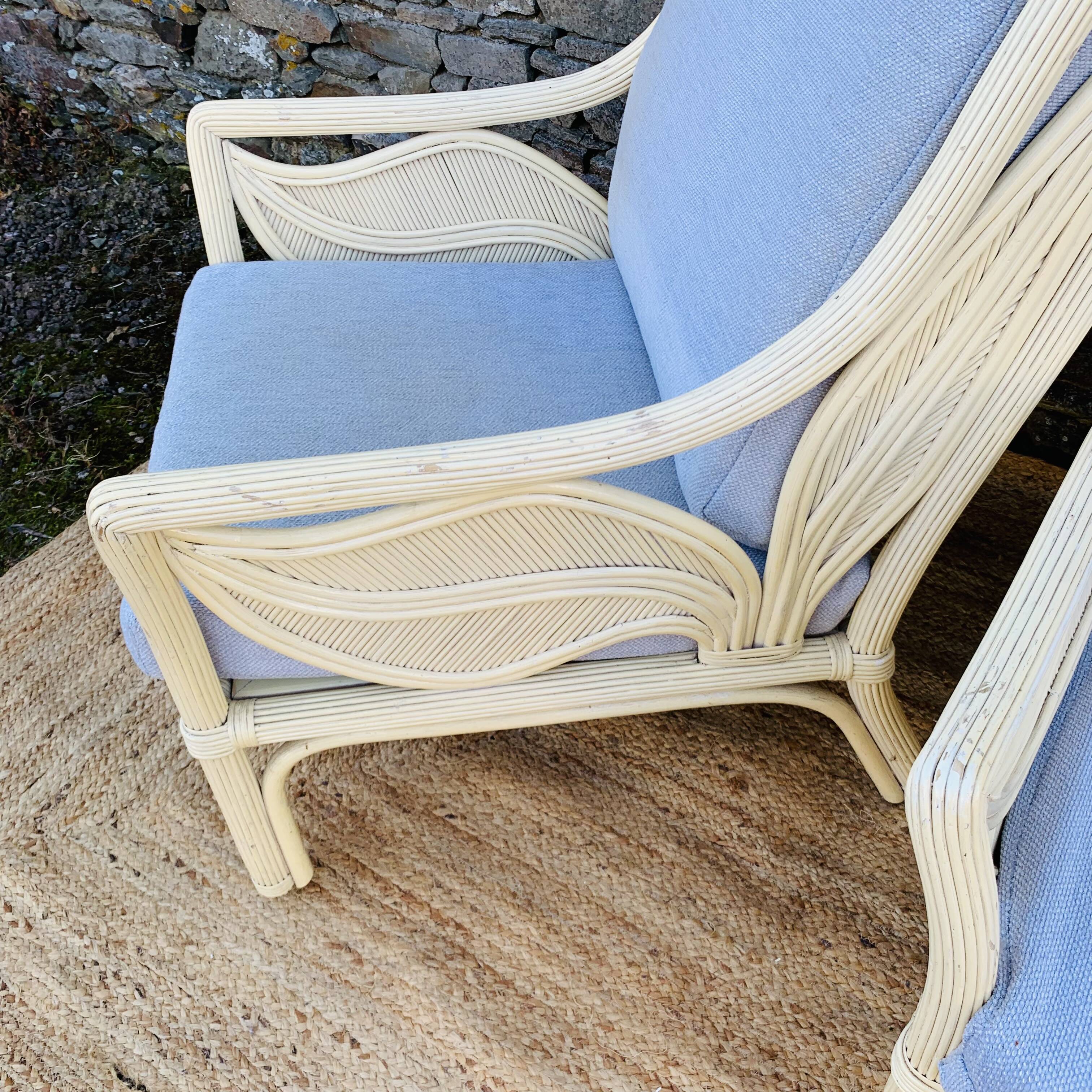 Pair of white rattan armchairs