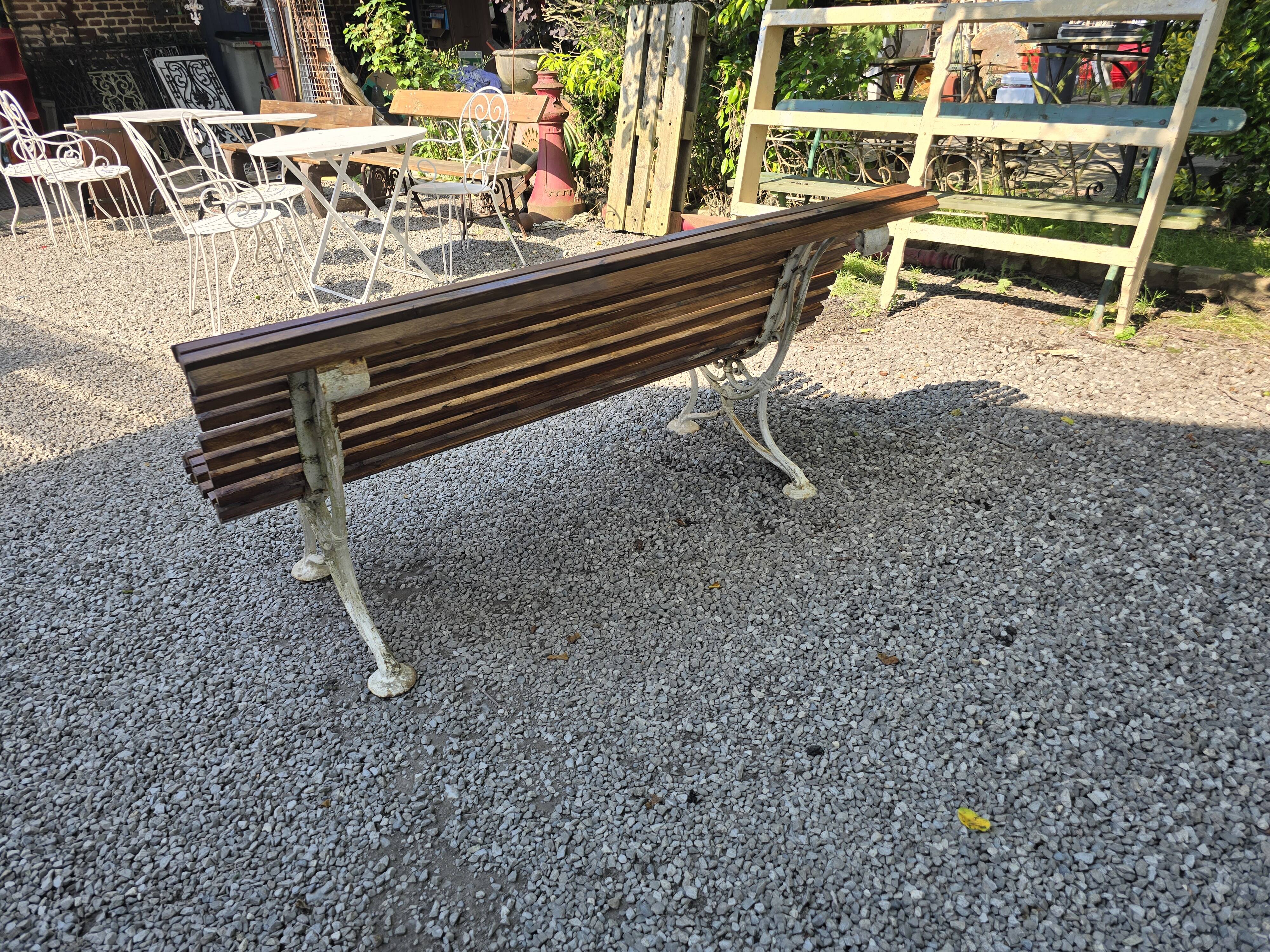 Garden bench with cast iron legs and oak slats