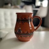 Terracotta ceramic carafe with geometric and white patterns