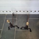 Old pair of wrought iron pegs with brass pine cone