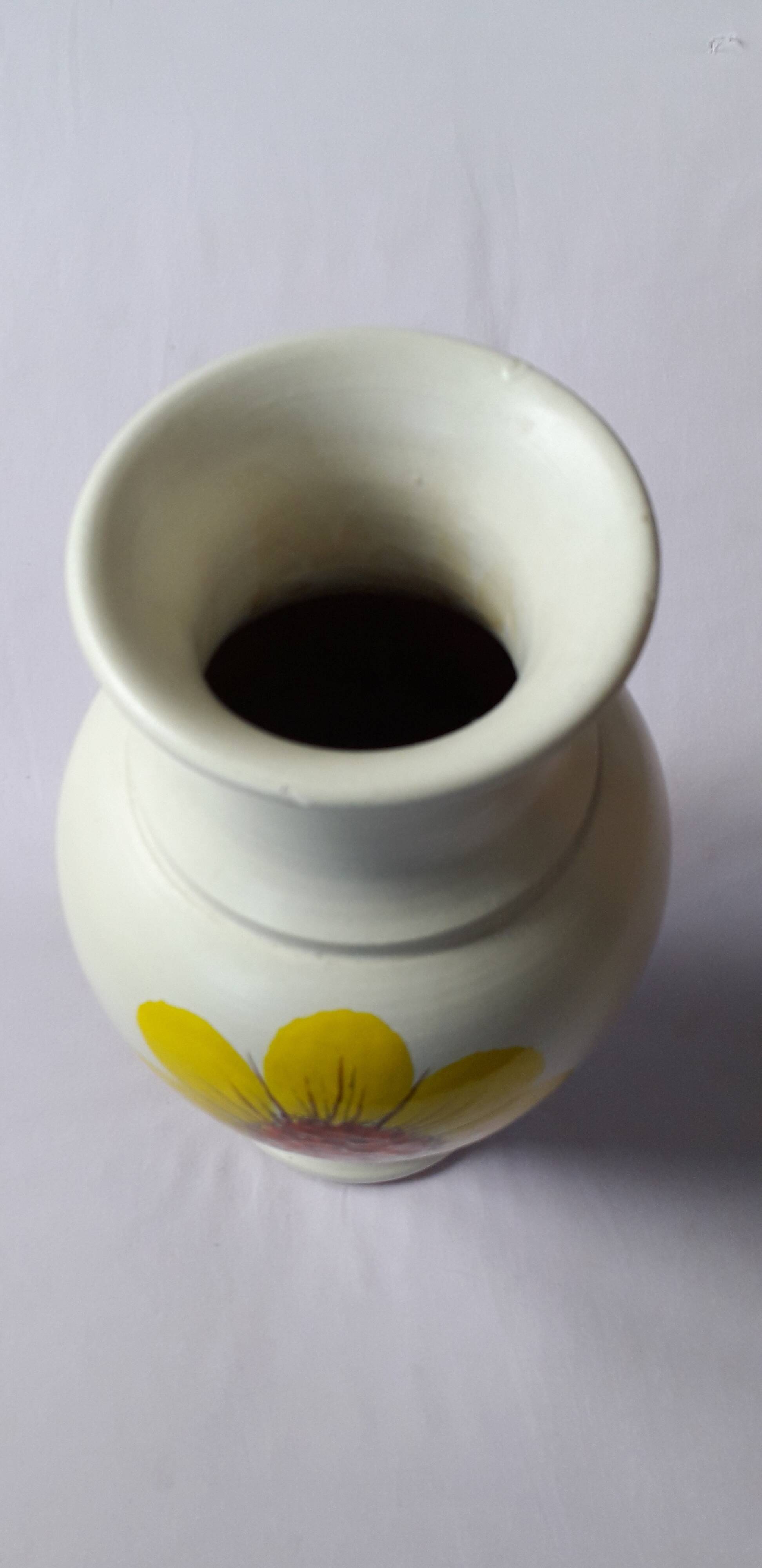 Vintage vase with floral decoration