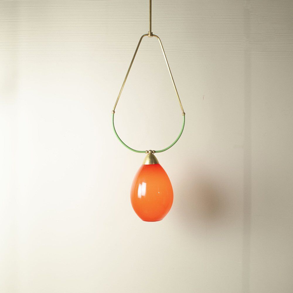 Hanging lamp with a brass frame in the shape of scales and a red-purple Murano glass diffuser.