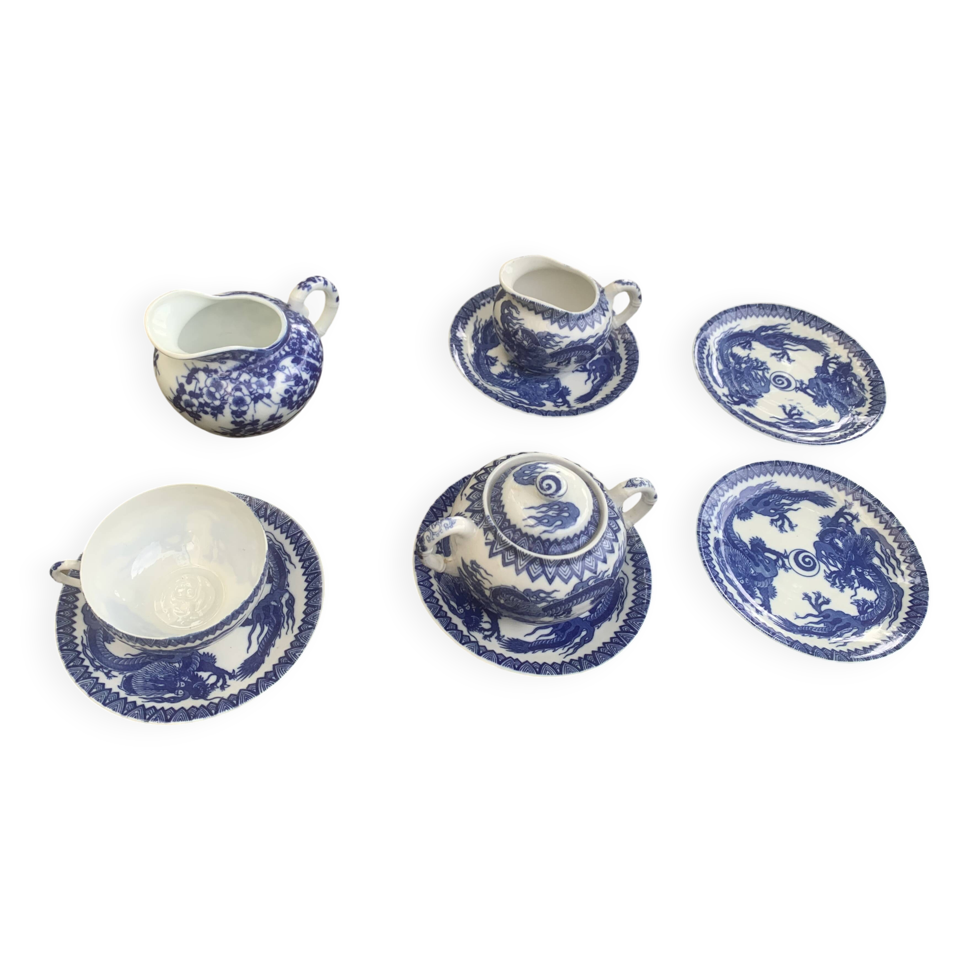 Porcelain tea set with dragon or cherry blossom motif