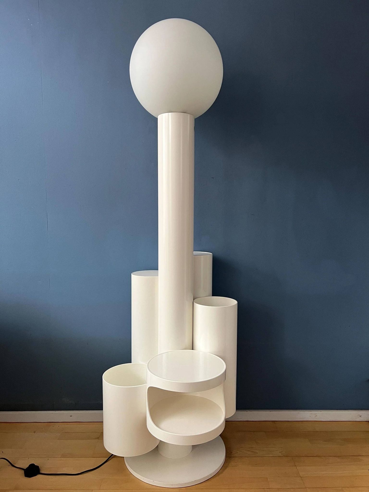 White floor lamp "Close Encounter" and plant stand by Kerst Koopman