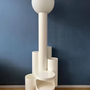 White floor lamp "Close Encounter" and plant stand by Kerst Koopman