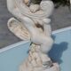 Pair of "cherub" candle holders in plaster