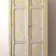 Small antique wardrobe patinated in beige and yellow.