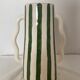 Handmade green and white striped ceramic vase with abstract corrugated handheld