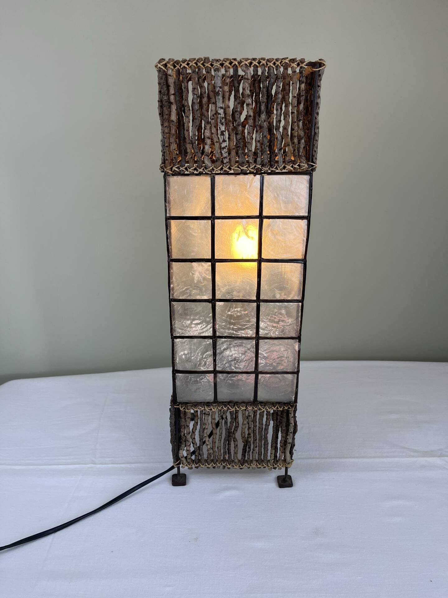 Capiz shell lamp and woven twigs