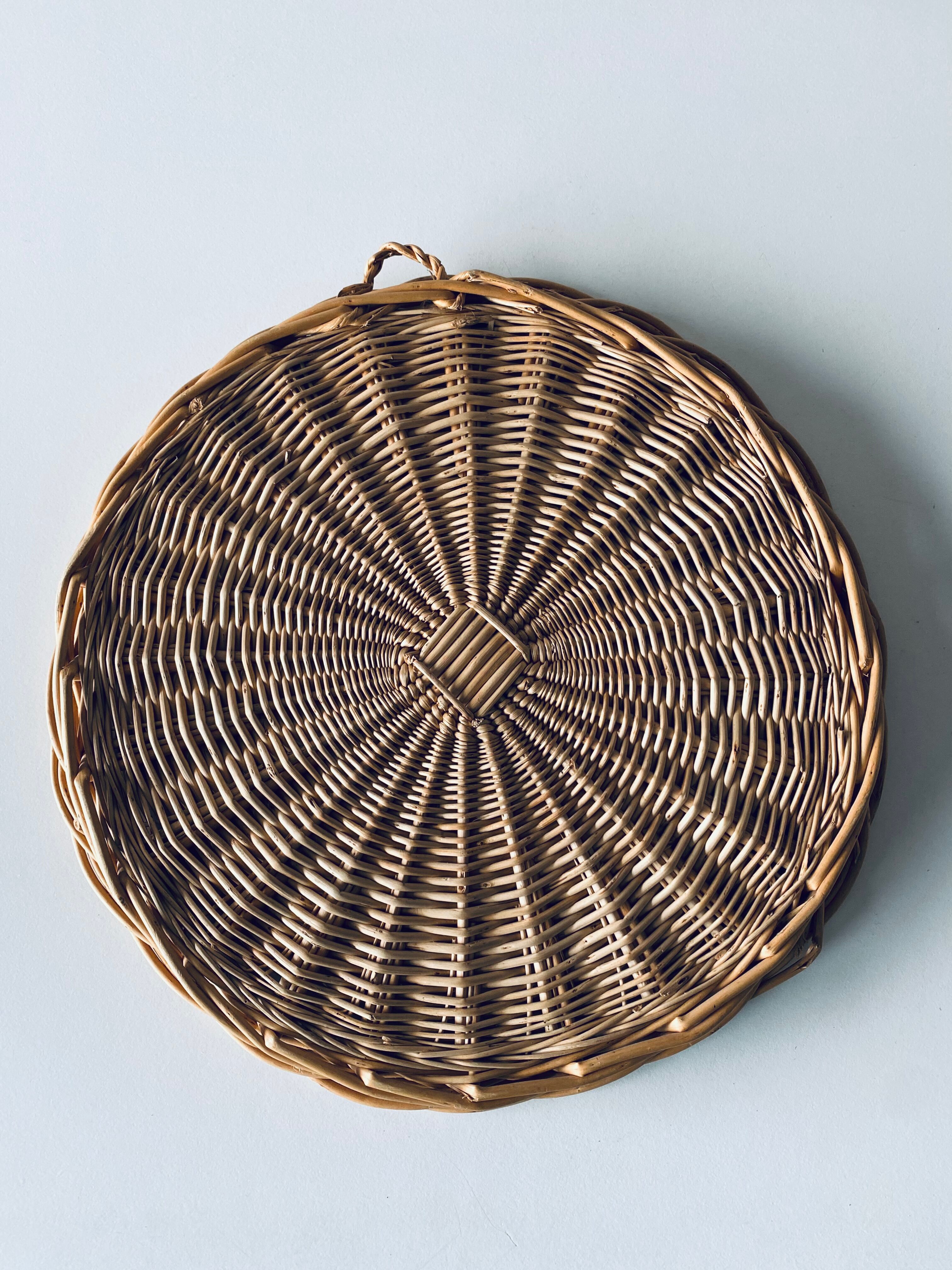 Round mirror in vintage wicker