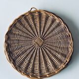 Round mirror in vintage wicker