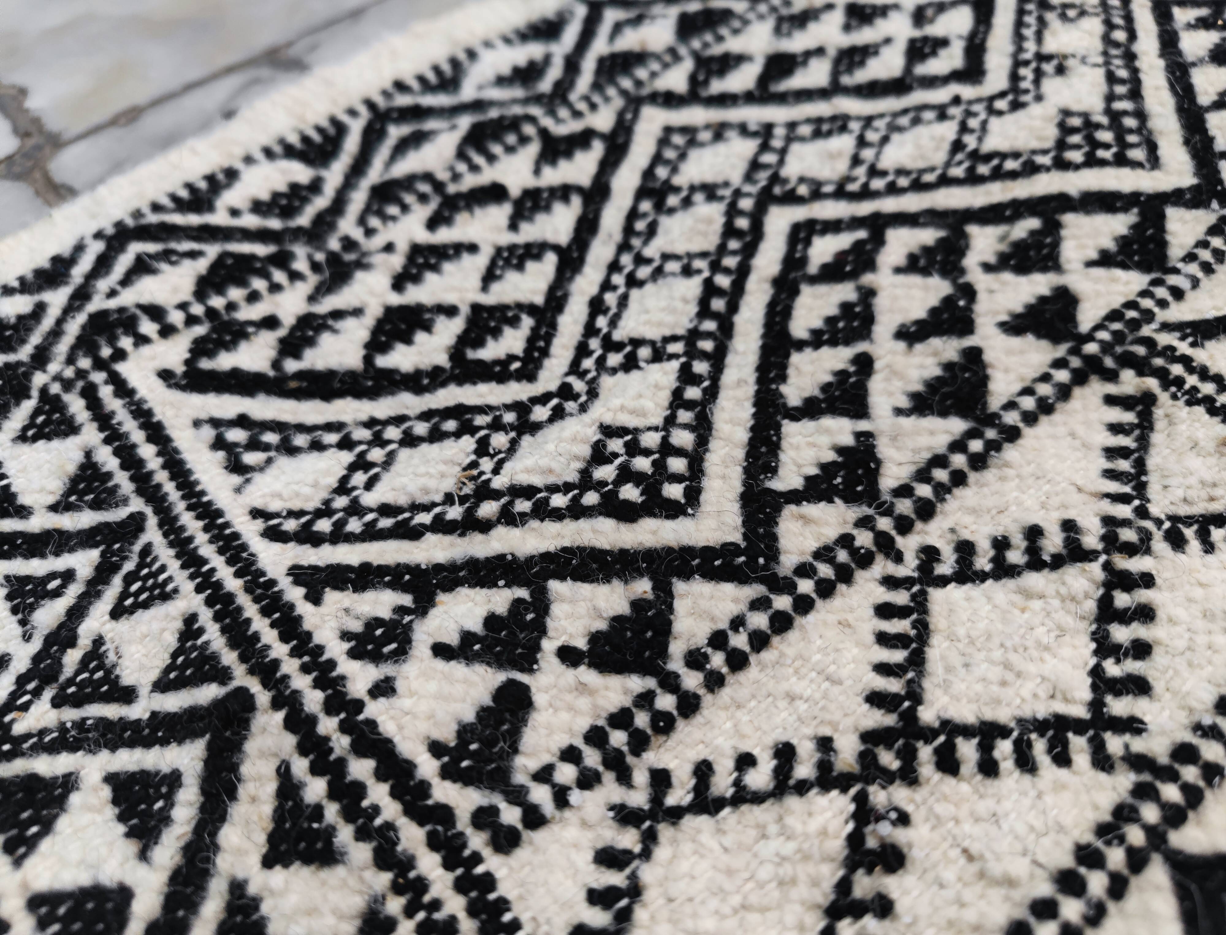 Handwoven black and white rug