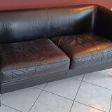 Black leather two-seater sofa