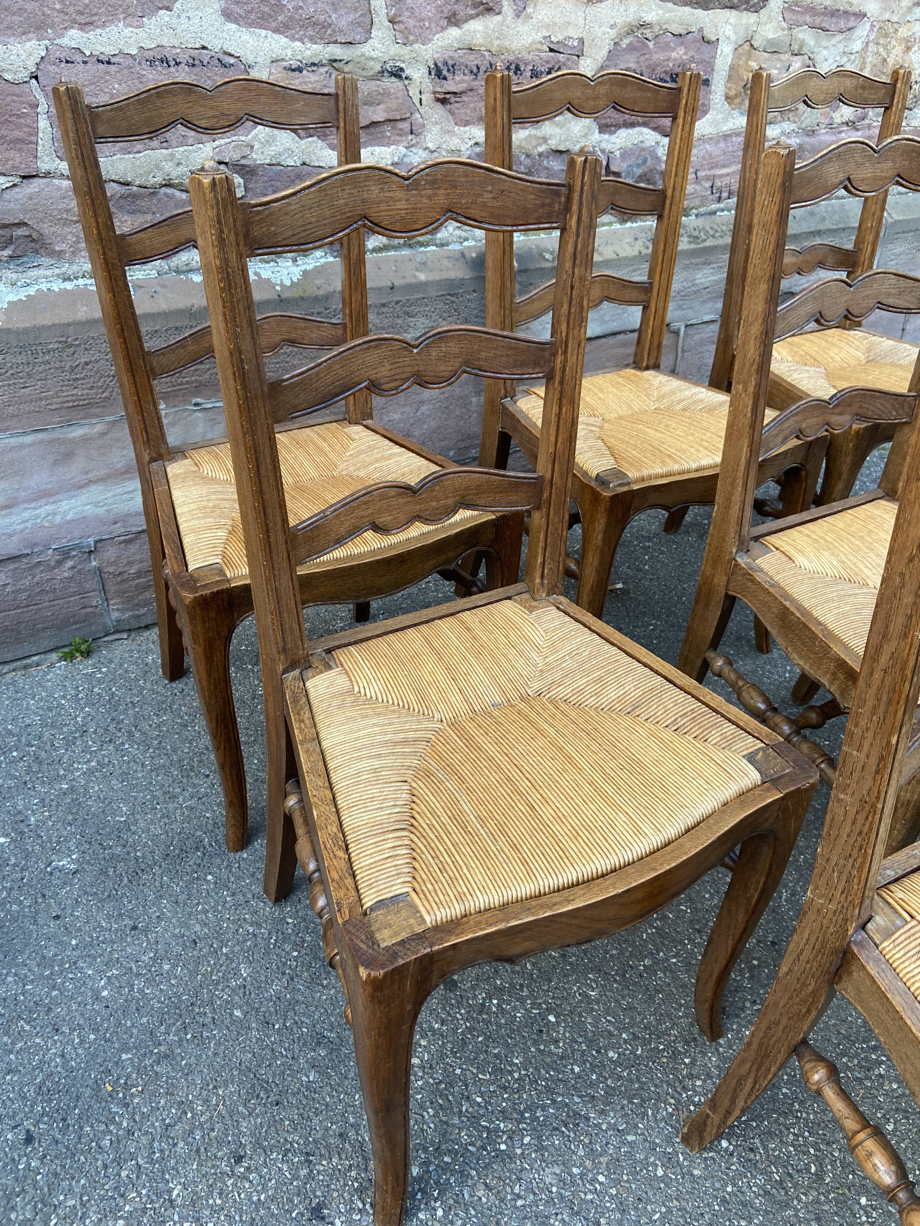 8 vintage rustic mulched chairs