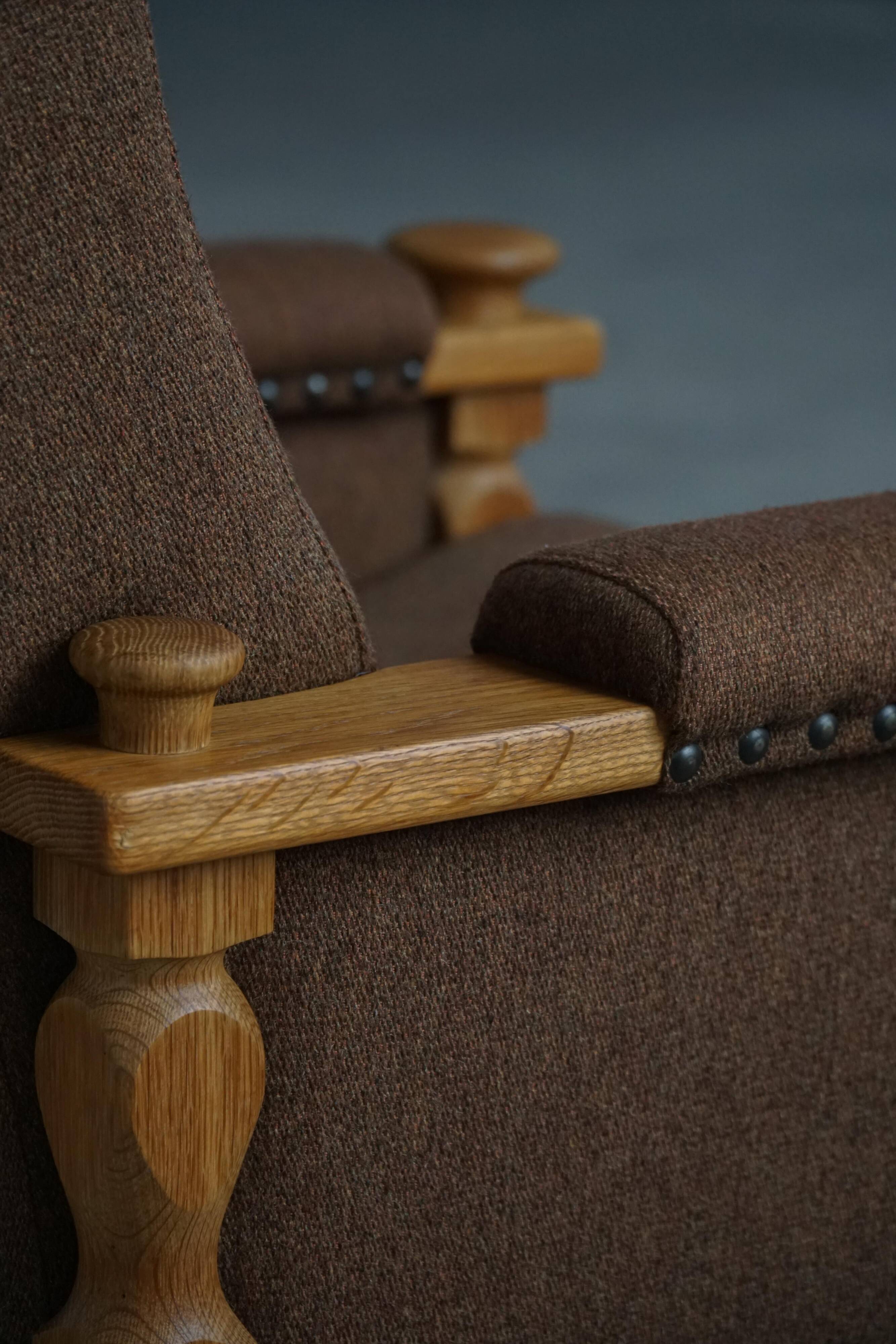 Modern Danish, a pair of lounge chairs in oak and wool, Henning Kjærnulf, 1960s.
