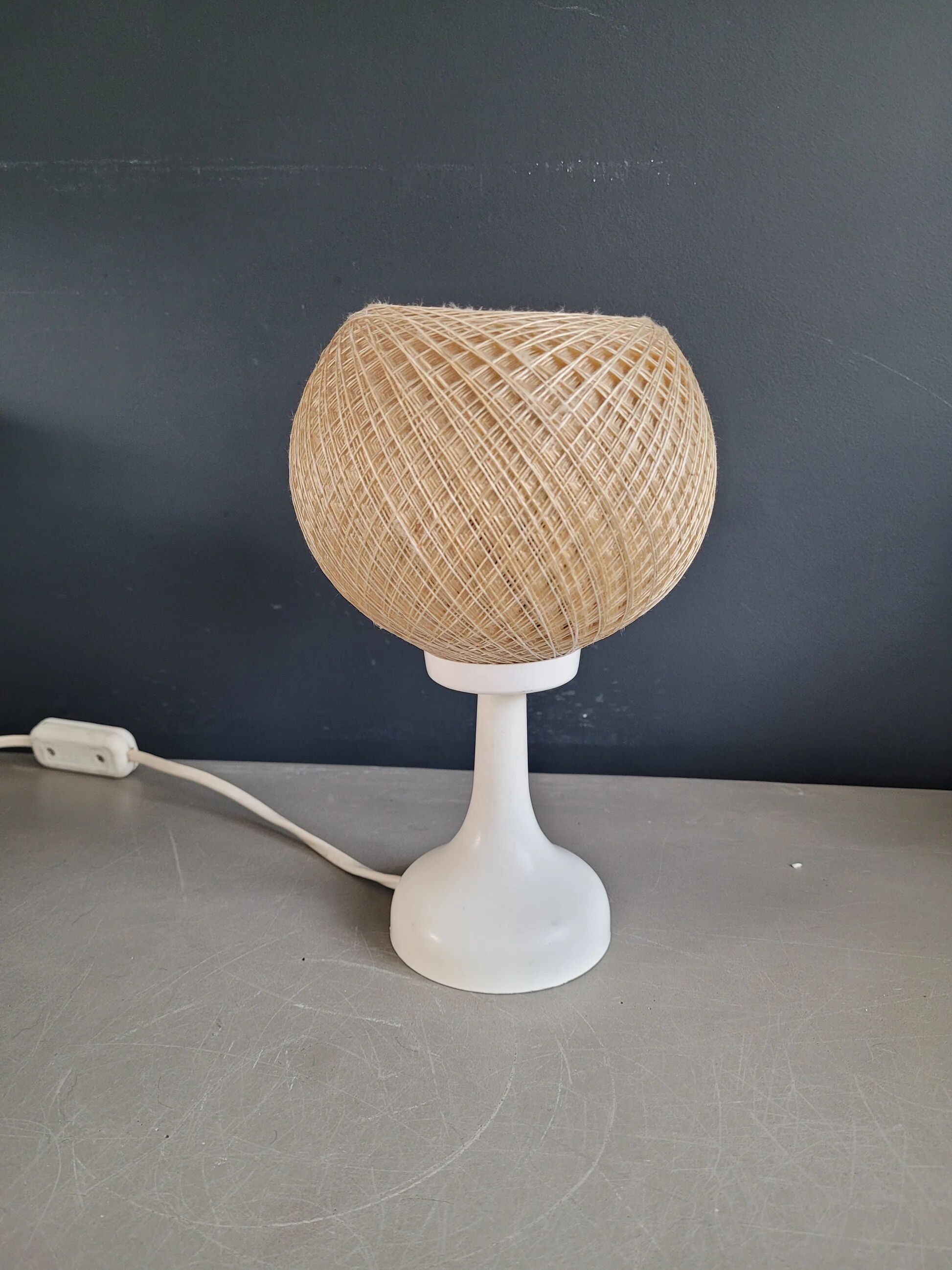 60's table lamp with tulip base and stretched wire shade.