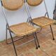 Pair of vintage metal and cane folding chairs