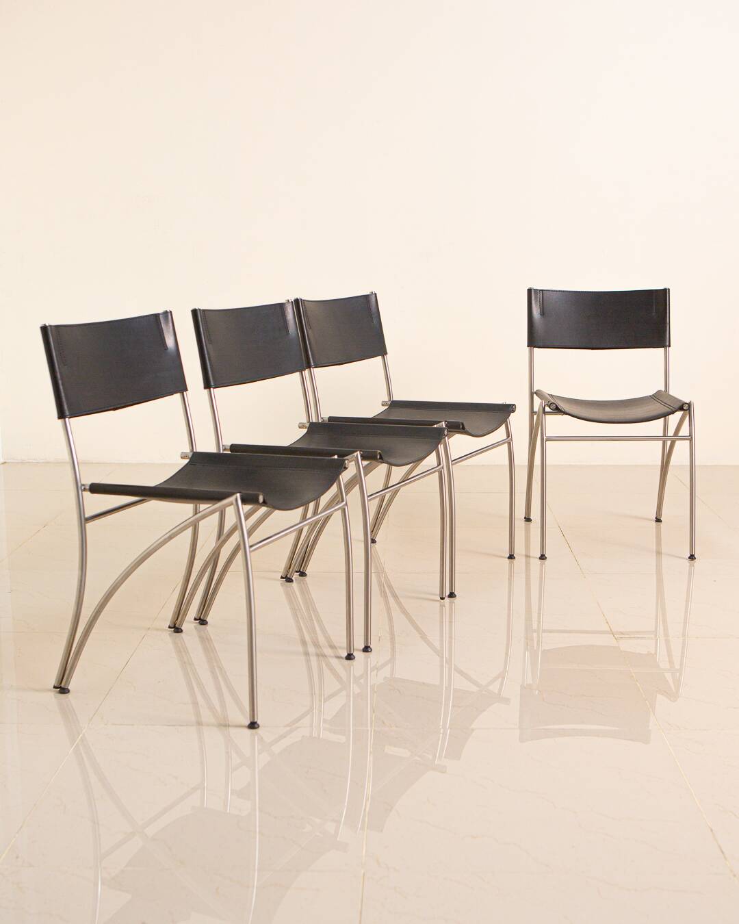 4 Italian black leather chairs from the 80s