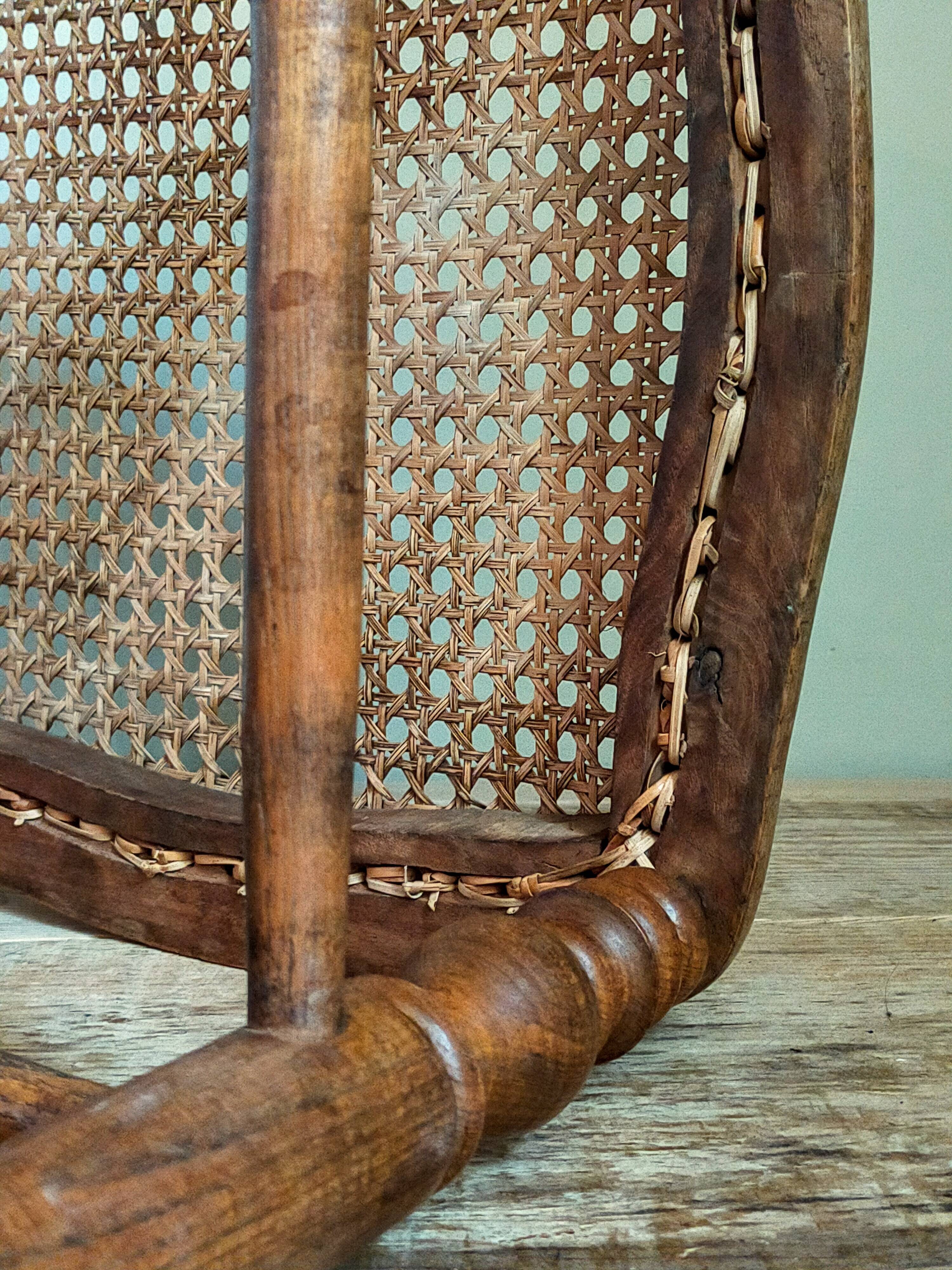 Antique stool with cane and turned wood