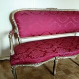 Louis XV style sofa in gilded wood and red pompadour fabric