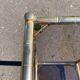 Square faux bamboo pedestal table in gold-plated brass and glass