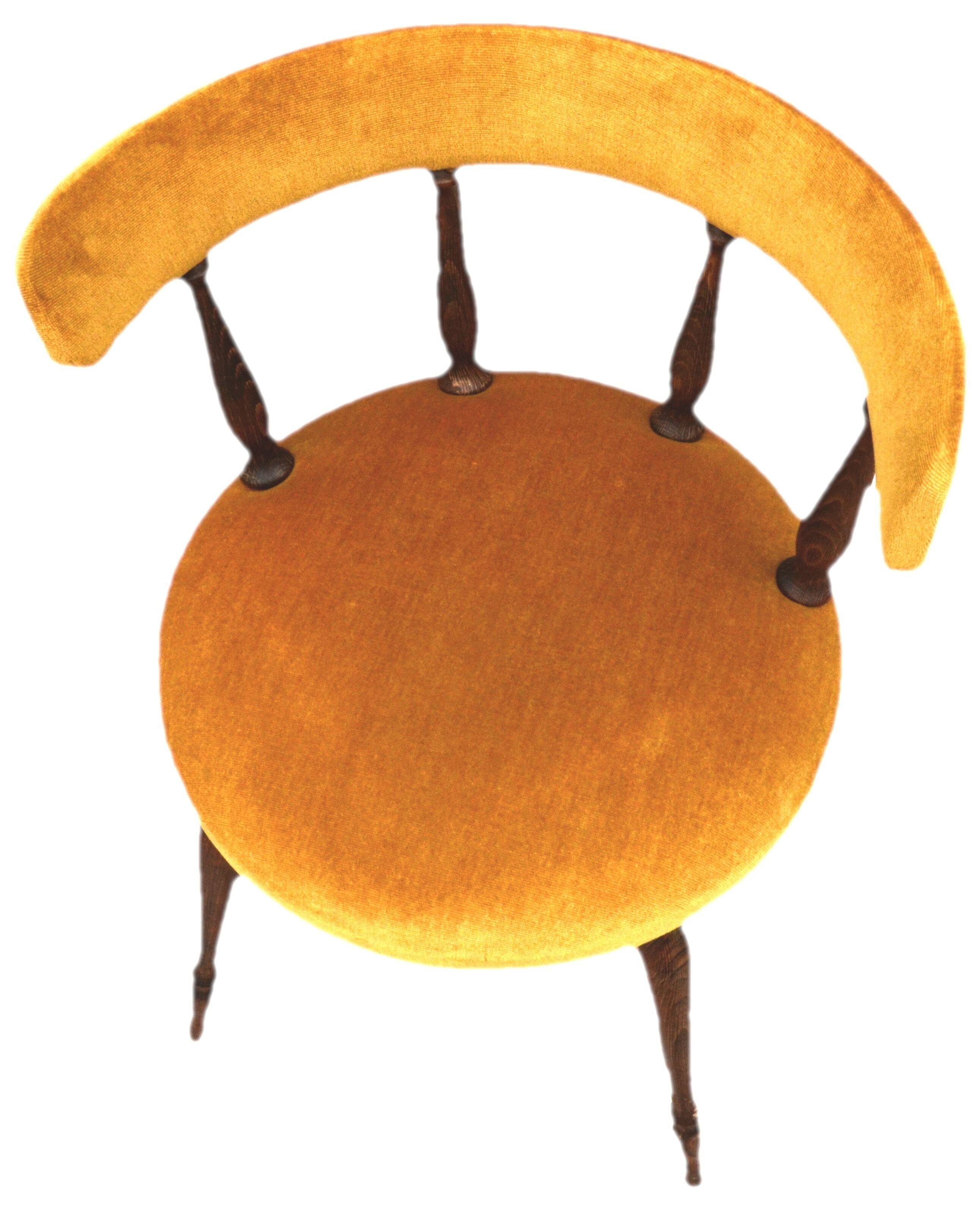 Mustard gondola armchair in the style of Helmut.